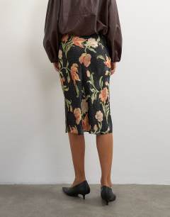 Model wearing Jacquard 90s length skirt in spot floral print