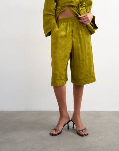 Model wearing Jacquard bermuda short in green