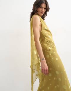 Model wearing Jacquard spot maxi occasion dress with open back in green