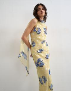 Model wearing Jacquard spot maxi occasion dress with open back in lemon and blue floral print
