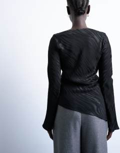 Model wearing Jacquard zebra slash neck long sleeve in black