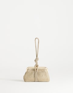 Model wearing Jade small wristlet grab bag in gold diamante