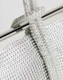 Model wearing Jade small wristlet grab bag in silver diamante