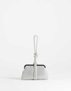 Model wearing Jade small wristlet grab bag in silver diamante