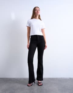 Model wearing Jamie flare high rise jean in black