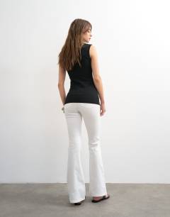 Model wearing Jamie Flare high rise jean in white