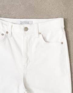 Model wearing Jamie Flare high rise jean in white