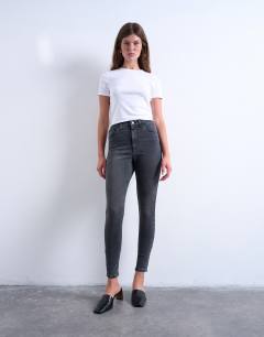 Model wearing Jamie high rise skinny jean in washed black
