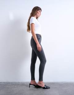 Model wearing Jamie high rise skinny jean in washed black