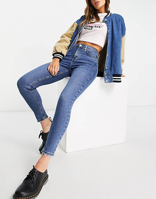 Topshop Jamie jeans with abraded hem in mid blue  