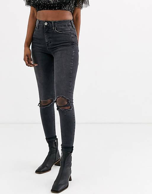 Topshop Jamie skinny jeans with rip knees in black | ASOS