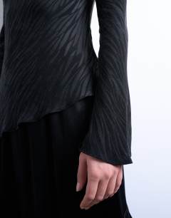 Model wearing Jaquard zebra slash neck long sleeve in black