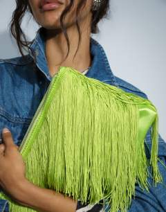 Model wearing Jasmine fringe envelope bag in green