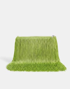 Model wearing Jasmine fringe envelope bag in green