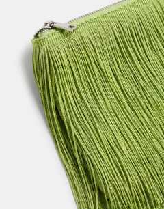 Model wearing Jasmine fringe envelope bag in green