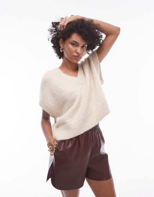 Topshop – Jasnobeżowa luźna kamizelka dzianinowa z dekoltem w szpic, obniżoną linią ramion i szwem z przodu