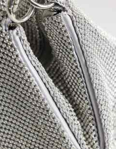 Model wearing Jax embellished asymmetric grab bag in silver