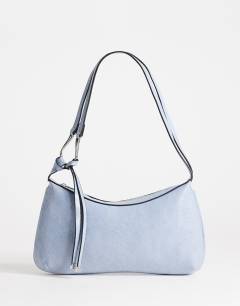 Model wearing Jaye shoulder bag in blue