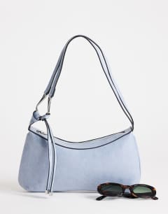 Model wearing Jaye shoulder bag in blue