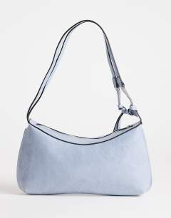 Model wearing Jaye shoulder bag in blue