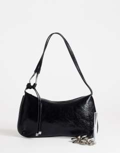 Model wearing Jaye small shoulder bag in black