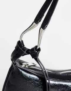 Model wearing Jaye small shoulder bag in black