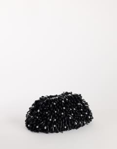Model wearing Jemma beaded clutch bag in black and silver