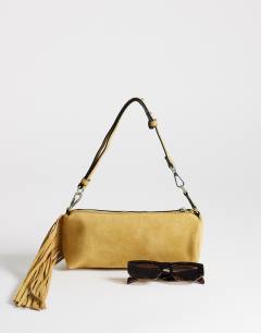 Model wearing Jemma real leather tassel shoulder bag in buttermilk