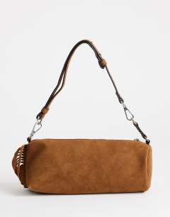 Model wearing Jemma real leather tassel shoulder bag in tan