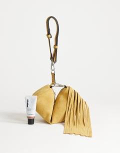 Model wearing Jemma small real leather tassel shoulder bag in buttermilk