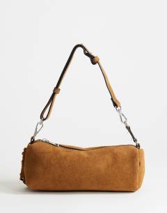 Model wearing Jemma small real leather tassel shoulder bag in tan