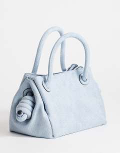 Model wearing Jenny grab weave bag in blue suedette