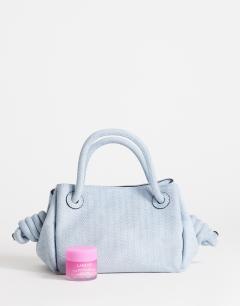 Model wearing Jenny grab weave bag in blue suedette