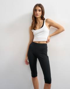 Model wearing Jersey capri leggings in black