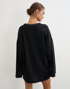 Model wearing Jersey cotton high v neck long sleeve mini dress in black