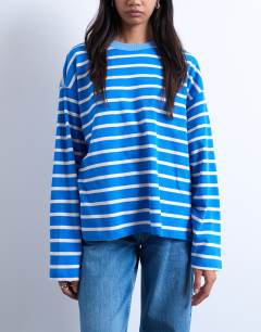Model wearing Jersey long sleeve crew neck top in blue stripe