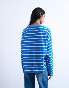 Model wearing Jersey long sleeve crew neck top in blue stripe