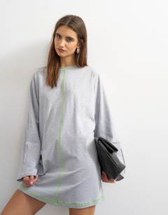 Model wearing Jersey rolled sleeve t-shirt dress in grey marl with lime contrast stitching