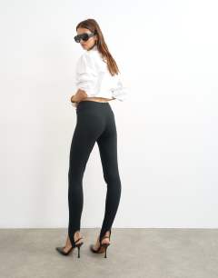 Model wearing Jersey stirrup leggings in black