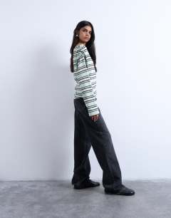 Model wearing Jersey stripe asymmetrical long sleeve top in green stripe