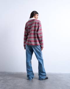 Model wearing Jersey stripe rugby long sleeve polo in burgundy