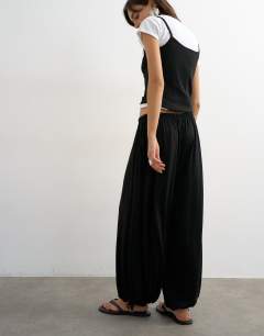 Model wearing Jersey viscose balloon trousers in black