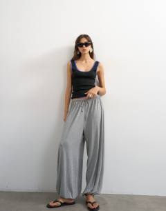 Model wearing Jersey viscose balloon trousers in grey marl