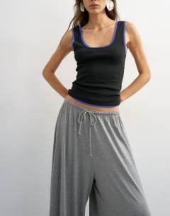 Model wearing Jersey viscose balloon trousers in grey marl