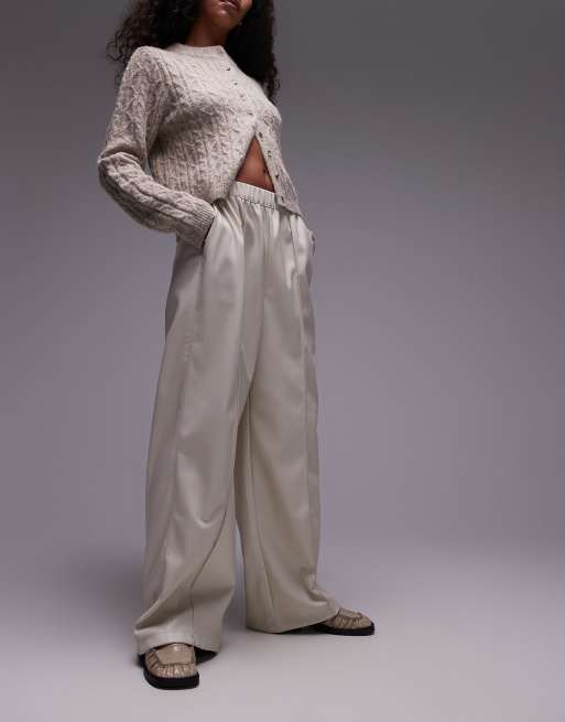Topshop - Joggers a fondo ampio in pelle sintetica color écru con cuciture a vista