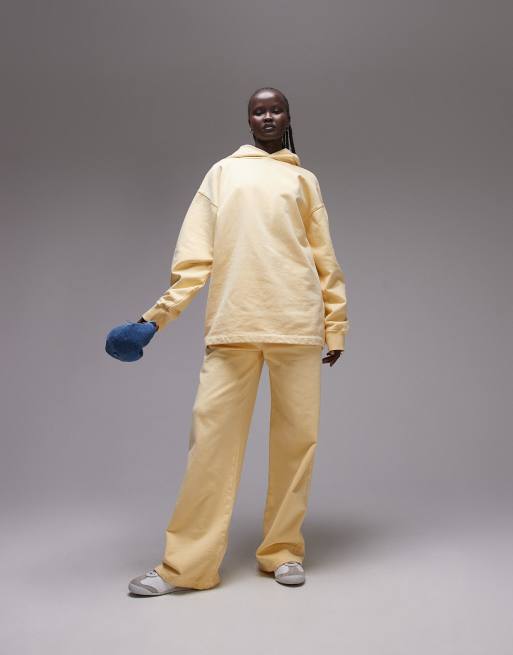 Topshop - Joggers con fondo ampio color latticello lavaggio acido