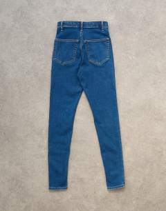 Model wearing Joni high rise skinny jean in vintage blue