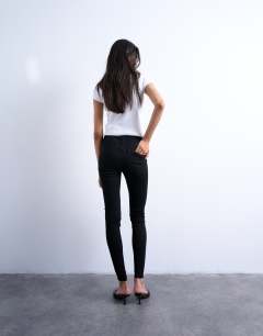 Model wearing Joni high rise super skinny jean in black