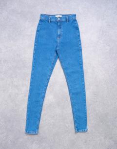 Model wearing Joni high rise super skinny jean in mid blue
