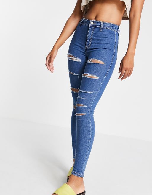 Topshop Joni jeans with super-rips in mid blue | ASOS